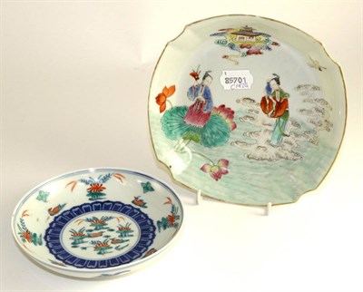 Lot 122 - A Chinese porcelain dish painted in famille rose enamels with maidens on clouds and leaves,...