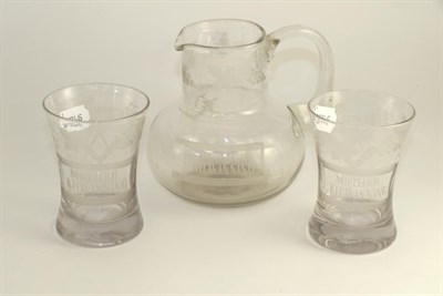 Lot 128 - Masonic glass ewer and pair of beakers, 19th century, engraved 'MOTHER KILWINNING' and with...