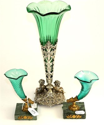 Lot 171 - A pair of gilt metal mounted green glass cornucopia in Empire style, with animal mask terminals, on