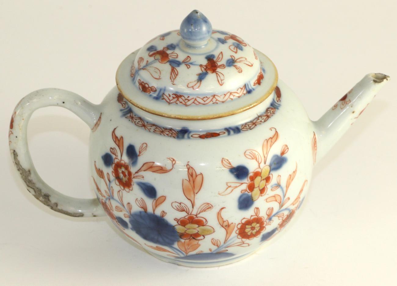 Lot 178 - A Chinese Imari teapot and cover, 18th century, globular form painted with foliage, 13cm high