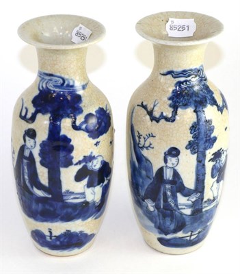 Lot 191 - A pair of Chinese crackle glaze baluster vases, painted underglaze blue with figures in...