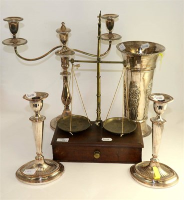 Lot 194 - A pair of Old Sheffield plate candlesticks with oval bases, 28cm; a two branch silver plated...