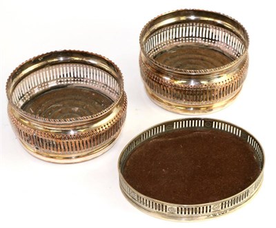 Lot 195 - Edwardian silver oval coaster, Sheffield 1903, with pierced gallery, 15.5cm wide; and a pair of...