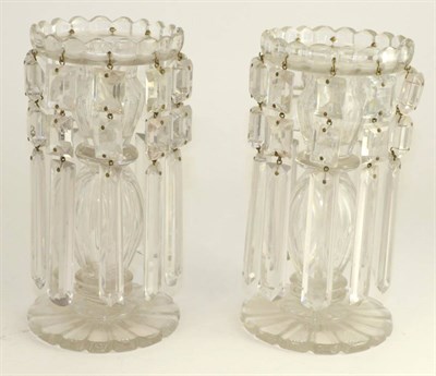 Lot 206 - A pair of 19th century cut glass table lustres, with faceted drops on panelled columns and circular