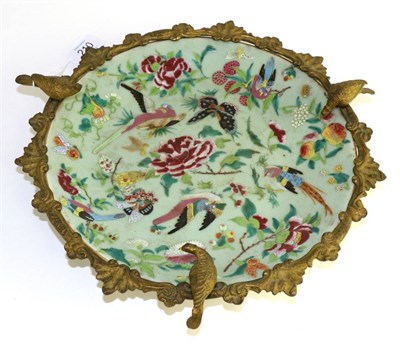 Lot 210 - A gilt metal mounted Cantonese celadon dish, 19th century, decorated with birds on foliage,...