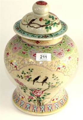 Lot 211 - A Chinese crackle glaze baluster jar and cover, painted in famille rose enamels with birds...