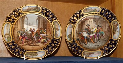 Lot 220 - A pair of Sevres style porcelain plates, late 19th century, painted with soldiers within a blue...