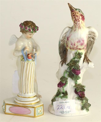 Lot 221 - A Meissen porcelain figure of Cupid, 20th century, standing beside hearts on a column, titles...