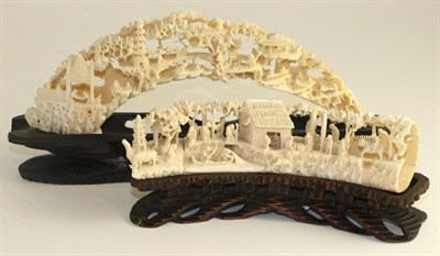 Lot 240 - A Cantonese ivory tusk group, late 19th century, carved with figures in landscape, 17cm long,...