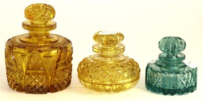 Lot 245 - An amber glass scent bottle and stopper, mid 19th century, cut with geometric patterns, 11.5cm...