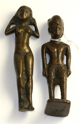 Lot 250 - A bronze figure of a pharaoh standing wearing headdress, 14.5cm high; and a similar figure of a...