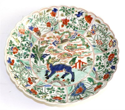 Lot 272 - A Chinese porcelain dish, Kangxi, painted in famille vert enamels with mythical beasts and...