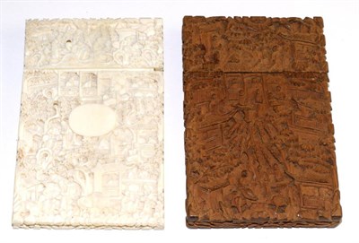 Lot 286 - A Cantonese ivory card case, 19th century, carved with a vacant oval cartouche and with figures...