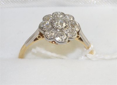 Lot 290 - A diamond cluster ring, an old cut diamond within a border of smaller old cut diamonds in white...