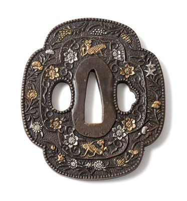 Lot 293 - A Japanese gold and silver inlaid iron tsuba, 19th century, of quatrefoil form decorated with...