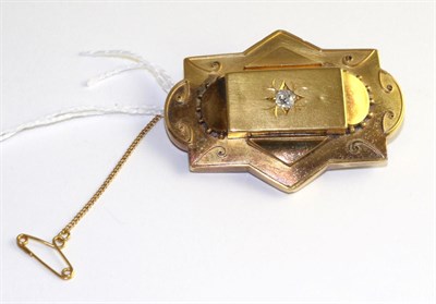 Lot 300 - A Victorian diamond brooch, an old cut diamond in a yellow star setting within a shaped panel frame