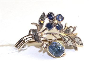 Lot 307 - A French sapphire and diamond spray brooch, a flower set with four oval cut sapphires to a...