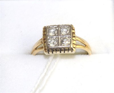 Lot 309 - An 18 carat gold diamond four stone ring, round brilliant cut diamonds in yellow claw settings to a