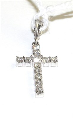 Lot 326 - An 18 carat white gold diamond cross pendant, set throughout with round brilliant cut diamonds...