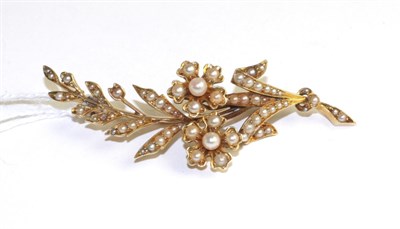 Lot 340 - A pearl spray brooch, a floral spray set throughout with seed pearls, measures 6.6cm x 2.3cm