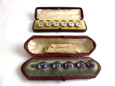 Lot 354 - A cased set of six mother-of-pearl blue paste and enamel buttons, mother-of-pearl discs inset...