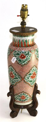 Lot 383 - A Chinese porcelain baluster vase in Transitional style, painted in green and red with panels...