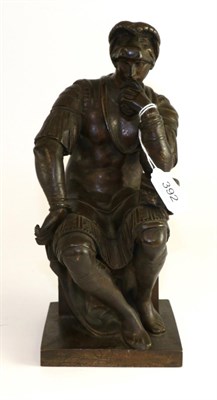 Lot 392 - A late 19th century bronze figure of a seated soldier, 28cm high