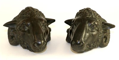 Lot 399 - A pair of bronze mounts, 19th century, modelled as rams masks, 15cm long