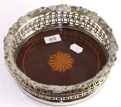 Lot 402 - A large inlaid mahogany and silver plate bottle coaster, 23cm