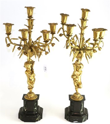 Lot 416 - A pair of gilt metal five-light candelabra in 18th century style, with cherub supports on...