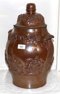 Lot 431 - # A brown salt glazed stoneware ovoid jar and a cover, circa 1940, with scroll handles applied with