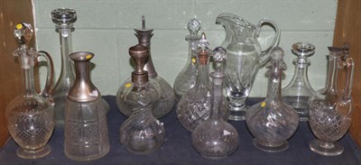 Lot 436 - A collection of twelve various 19th century and later decanters including one with silver...