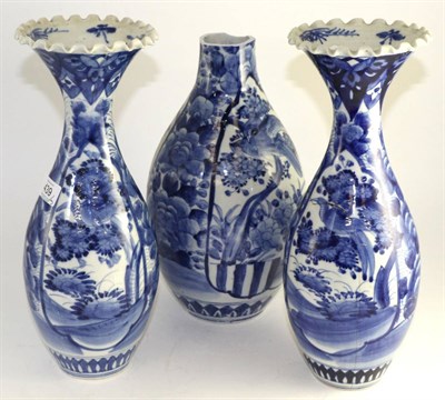 Lot 439 - A pair of Arita porcelain baluster vases, Meiji period, 37cm high; and a similar vase (3)