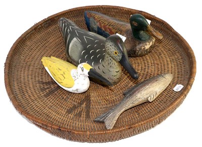 Lot 440 - A painted wood decoy duck, 37cm long; a similar decoy duck, 31cm long; a painted wood bird; a...