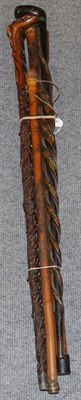 Lot 458 - Five various oriental and other carved sticks