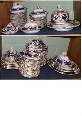 Lot 469 - An extensive Davenport porcelain dinner service, circa 1830, gilt with vine tendrils on a blue...