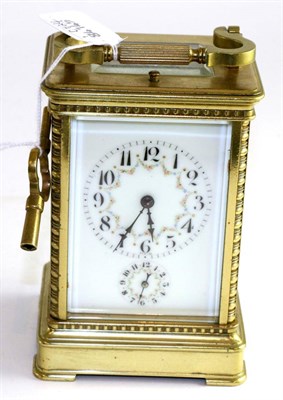 Lot 475 - A brass striking repeating alarm carriage clock, circa 1900, carrying handle and repeat button,...