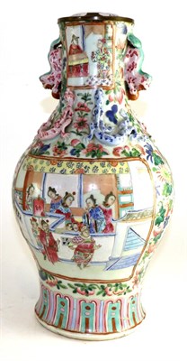 Lot 485 - A Cantonese porcelain baluster vase, 19th century, painted in famille rose enamels with figures...