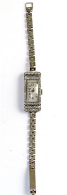 Lot 525 - A lady's 18 carat white gold diamond set cocktail wrist watch, circa 1928, with lever movement...