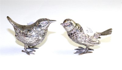 Lot 526 - A pair of silver pepperettes stamped '800' as songbirds, 5cm high