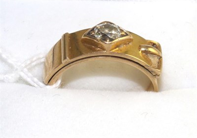 Lot 528 - A diamond set buckle ring, an old cut diamond in a yellow star setting to a buckle motif top,...