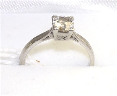 Lot 530 - A diamond solitaire ring, an old cut diamond in a white square claw setting , to knife edge...