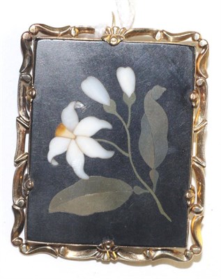 Lot 547 - A pietra dura brooch, a rectangular pietra dura plaque with a white lily, in a scroll frame, plaque