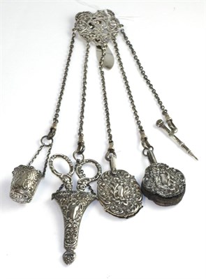 Lot 549 - A Victorian silver chatelaine comprising thimble holder, pair of scissors, aid memoir, pencil and a