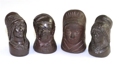 Lot 553 - Four stoneware 'character' bottle stoppers