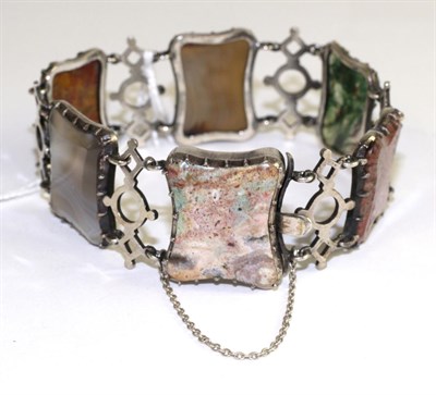 Lot 573 - A Scottish hardstone bracelet, six cushion cut hardstone set links alternate with pierced...