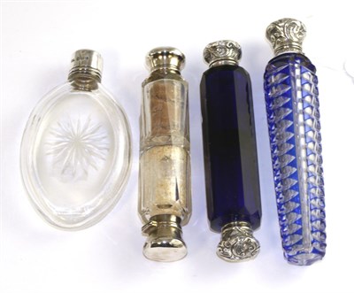 Lot 577 - A George IV cut glass scent bottle with silver screw top, Birmingham, 1910, a blue flash glass...