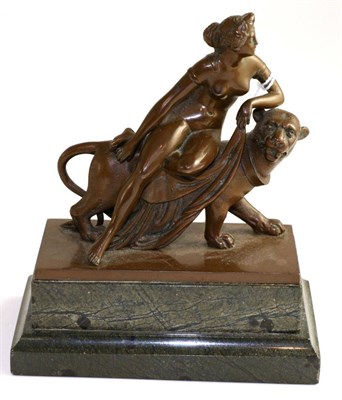 Lot 590 - A classical bronze group, nude maiden on a big cat, 14cm high