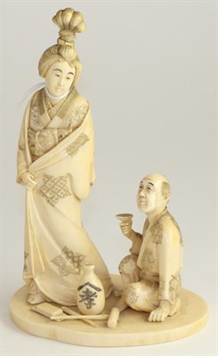 Lot 591 - A Japanese ivory okimono, Meiji period, as a standing maiden beside a crouching man holding a...