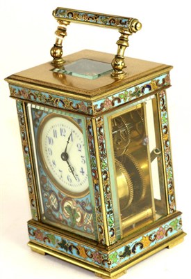 Lot 592 - A champleve enamel carriage timepiece, circa 1910, carrying handle, multi-coloured champleve enamel